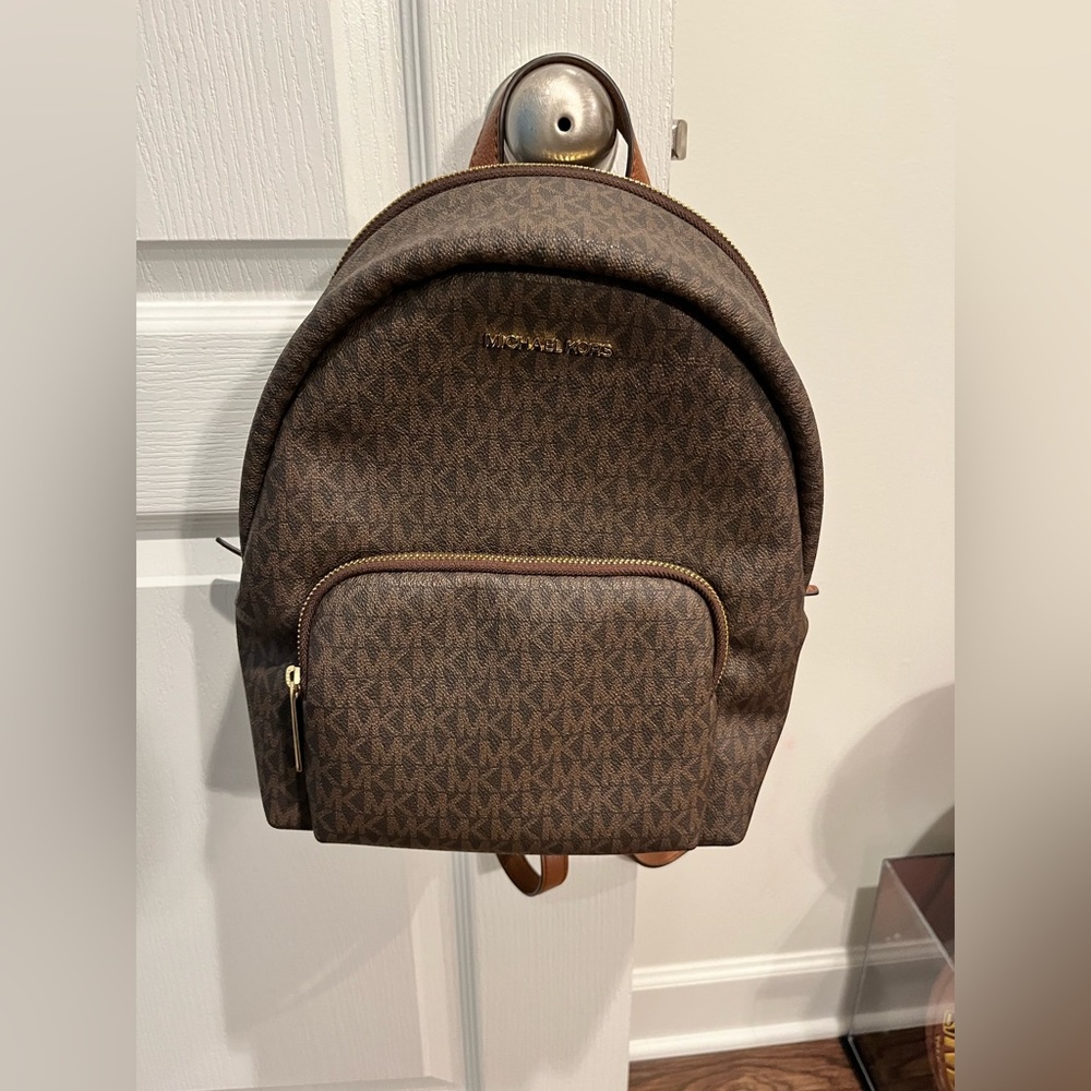 Brown michael kors backpack/purse. Used only one time